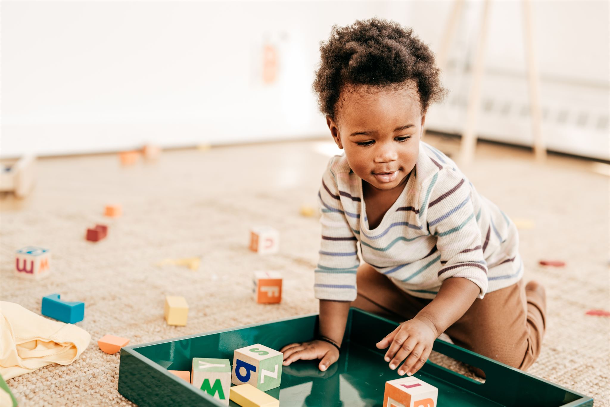 Toddler-playing-with-toys